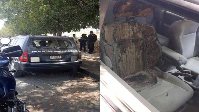 Con bombas molotov queman patrullas de la policía Michoacán en Morelia