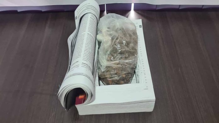 Hallan heroína en la Terminal de Autobuses de Morelia; estaba oculta en un libro