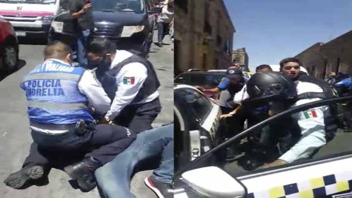 20 policías arrestan a un padre de familia enfrente de los niños de primaria