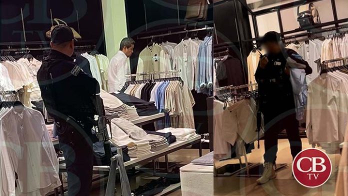 ¡Compra segura! Con arma larga policía resguarda compras de su “jefe” Carlos Paredes, alcalde de Tuxpan.