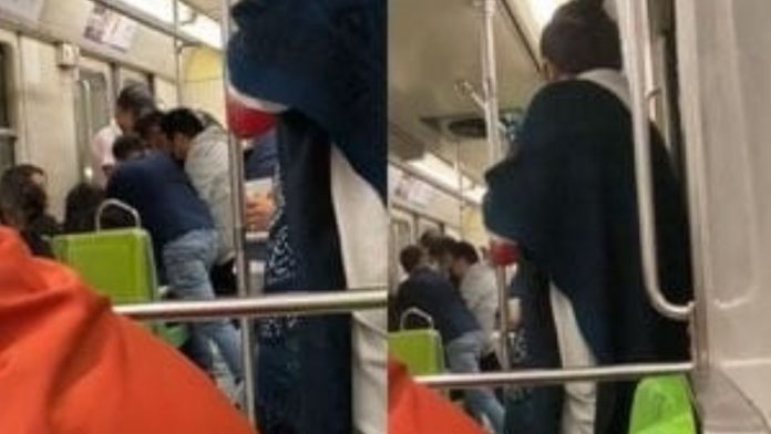 VIDEO: Hombres protagonizan pelea en vagón del Metro y músico no deja de tocar