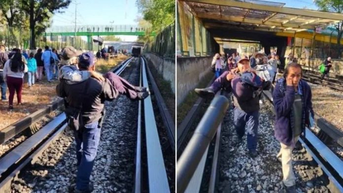 Policía carga a adulto mayor para ponerlo a salvo tras choque de trenes en Linea 3