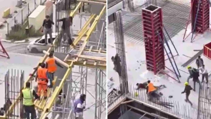Albañiles se pelean en lo alto de una constricción