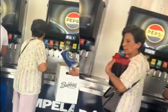 Graban a un a señora rellenando garras de refresco en el Costco